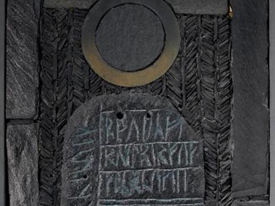 Black Sun of Winter, a slate mosaic on a wood panel with a large central section with incised runic inscriptions, by George Garson, Scottish, 1980. © George Garson; NMS. Black Sun of Winter, a slate mosaic on a wood panel with a large central section with incised runic inscriptions, by George Garson, 1980.