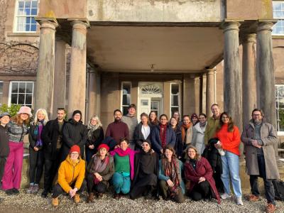 Fellows and Affiliates at the Burn in the Scottish Highlands, November 2024 Fellows at the Burn in the Highlands, Nov 2024 - a group of people stand in front of a house