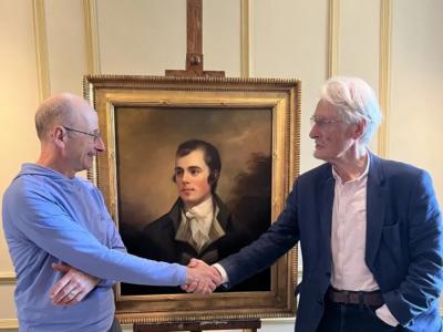 William Zachs and Duncan Thomson with the Raeburn: two men shaking hands in front of an oil painting