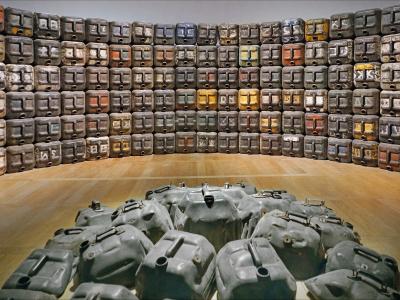 Image of oilcans stacked into a wall. Image by Jean-Pierre Dalbéra. https://www.flickr.com/photos/dalbera/51422594515/
