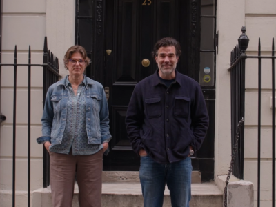 Hester Blum and Rob Delaney stand in front of a Georgian townhouse