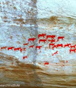 Rock art: red painted animals against grey rock